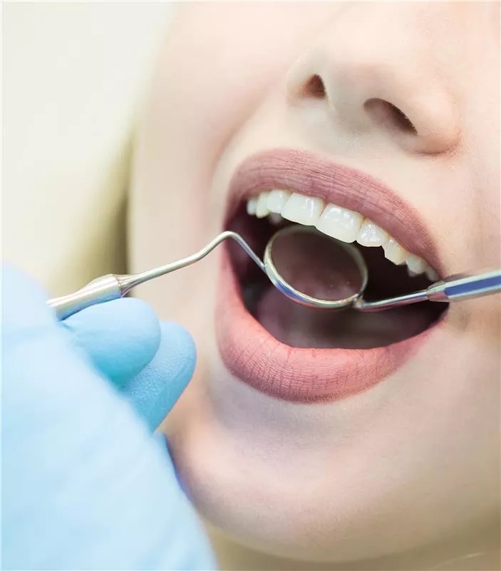 Patient smiling during a dental exam